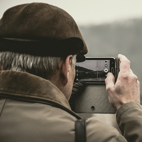 man taking photos with phone color