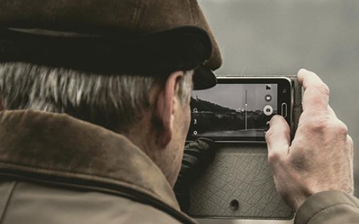 man taking photos with phone color