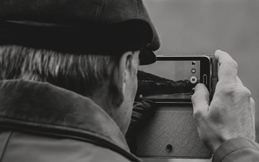 Man taking photo square